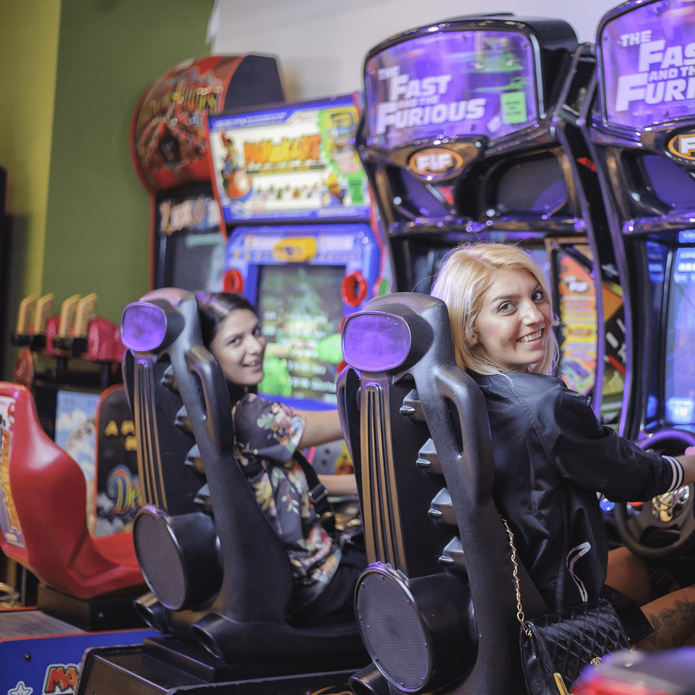 Two ladies on arcade machines